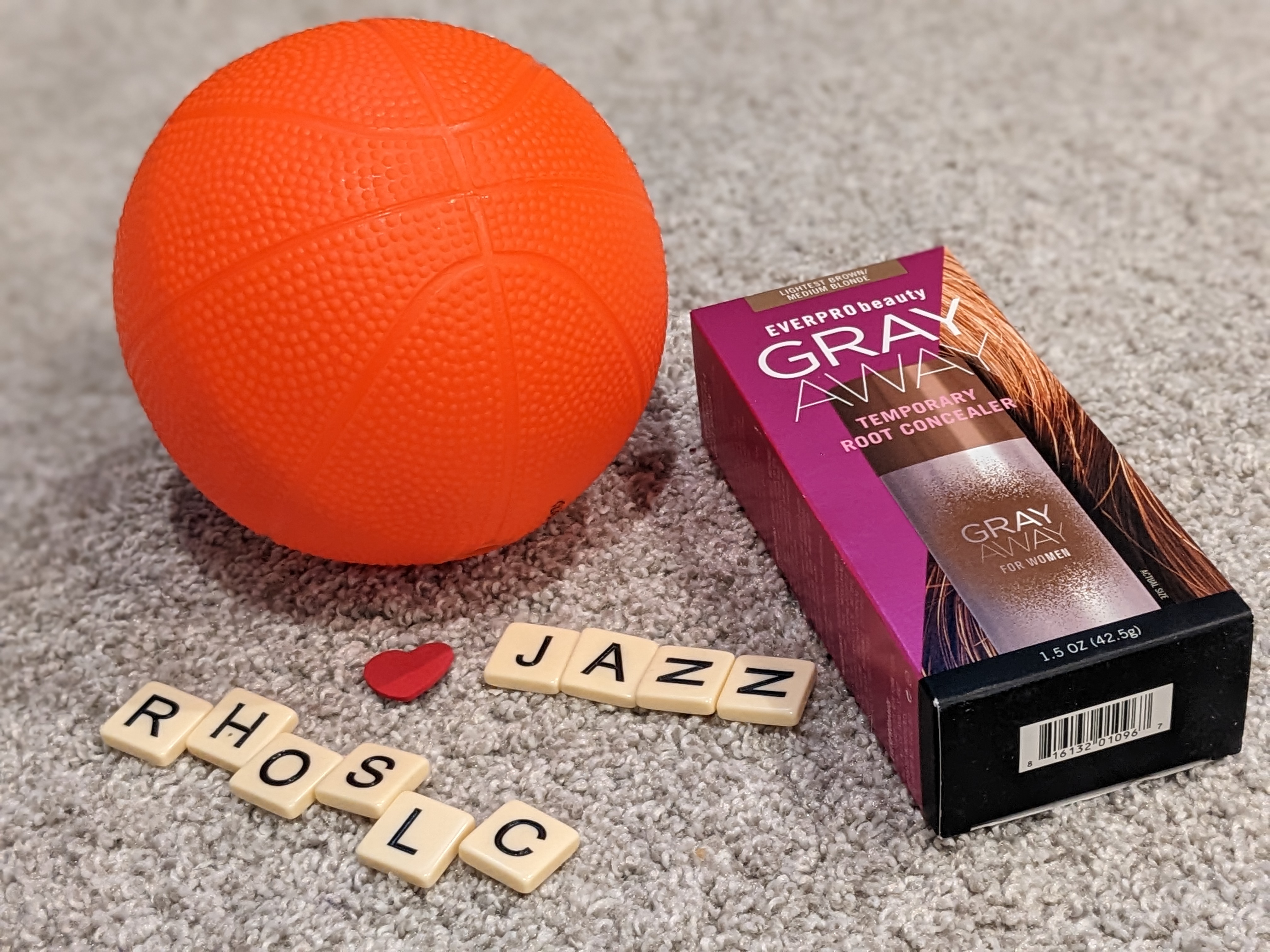 Toy basketball, hair color, and letter tiles