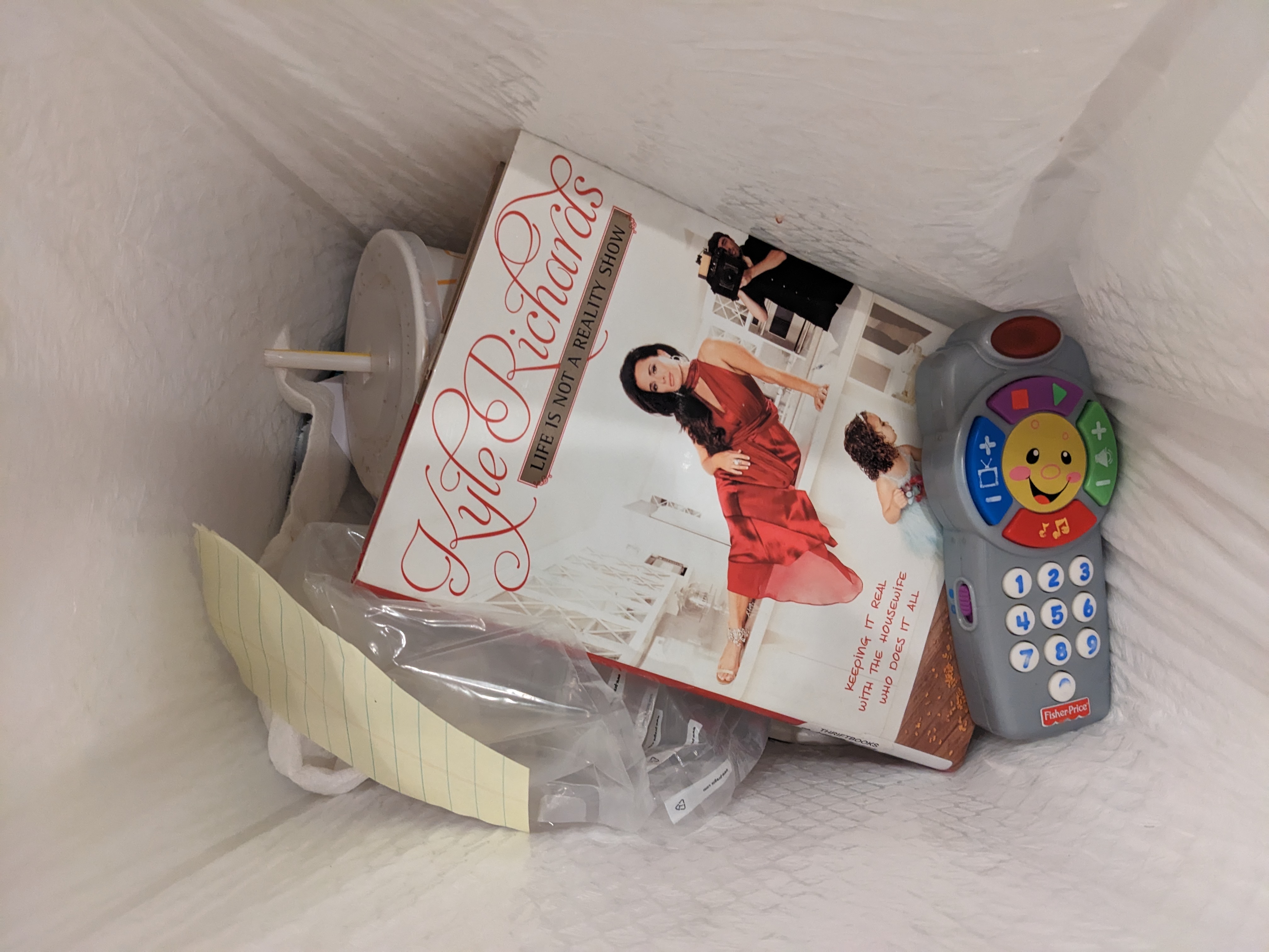 Life Is Not a Reality Show book in the trash